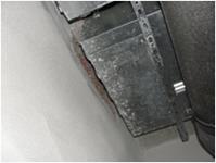 nicht verputzte Innenwand hinter Anlagentechnik